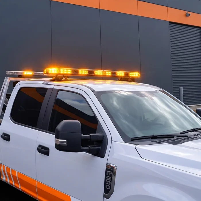 Amber LED roof warning lightbar fitted to an Australian tow truck during roadside recovery.